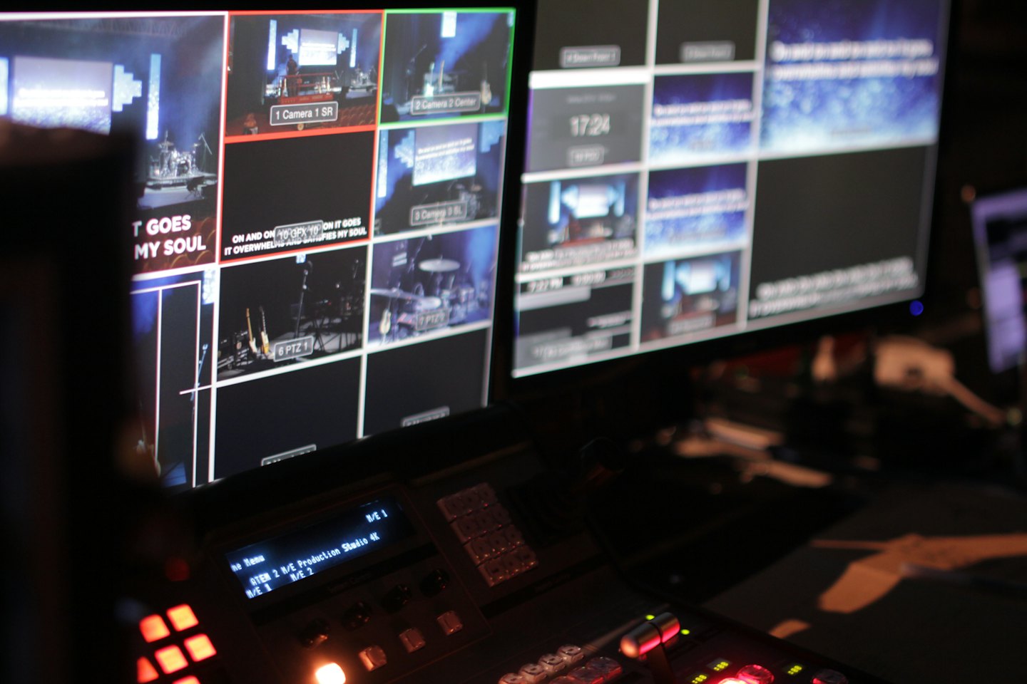 Video production control room with monitors and buttons.